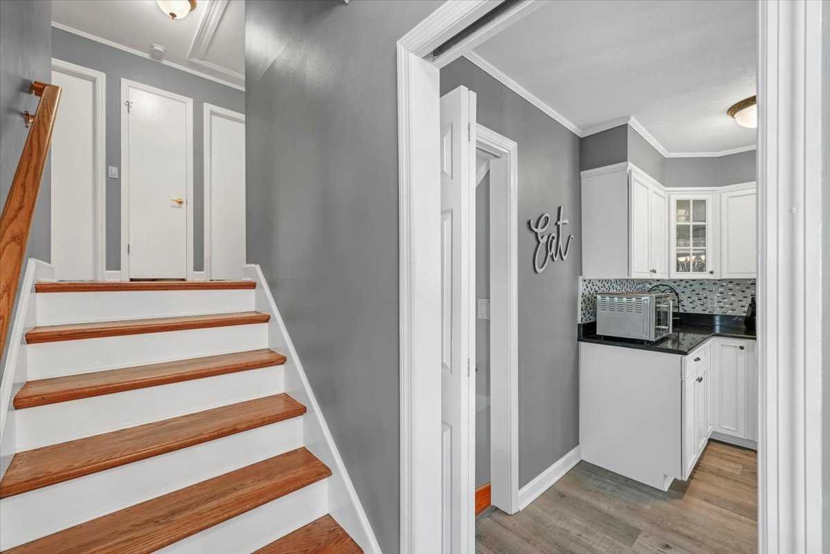 6 Broadview Road Poughkeepsie, NY 12603 - Photo 19 of 35 a view of a hallway with wooden floor and staircase