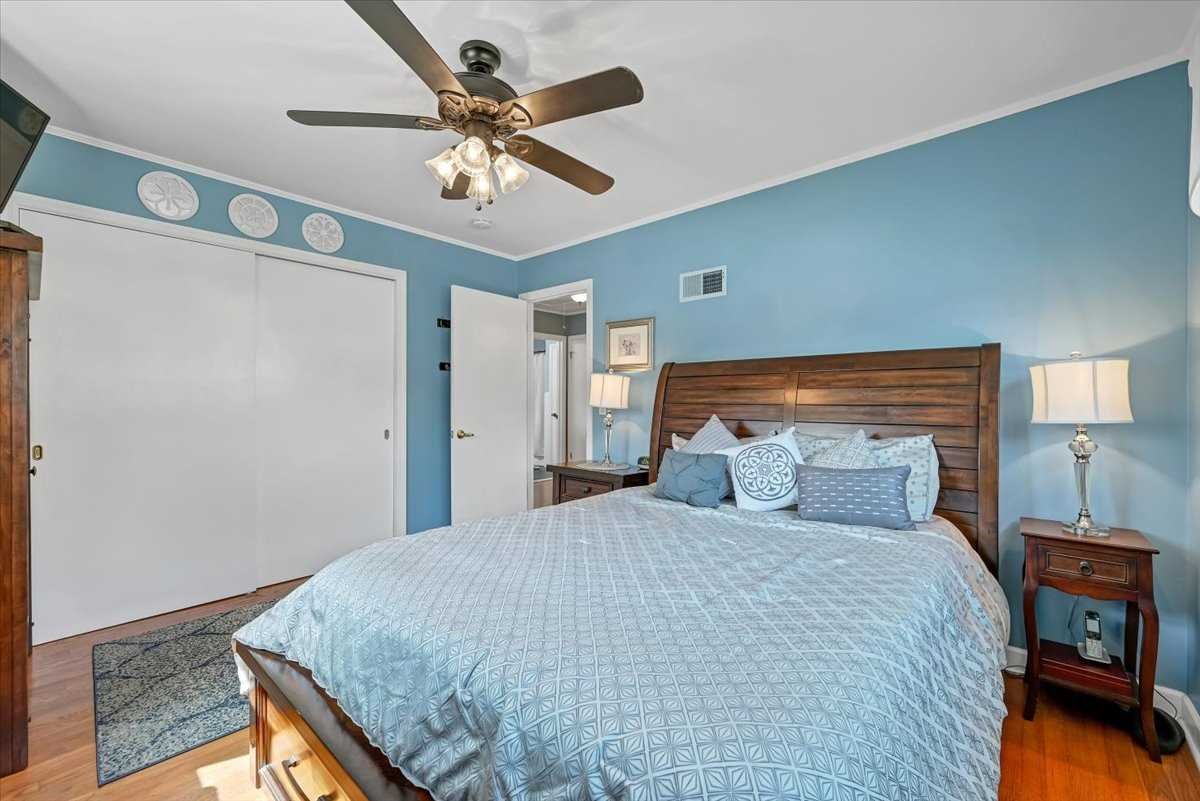 6 Broadview Road Poughkeepsie, NY 12603 - Photo 22 of 35 a bedroom with a large bed and a chandelier