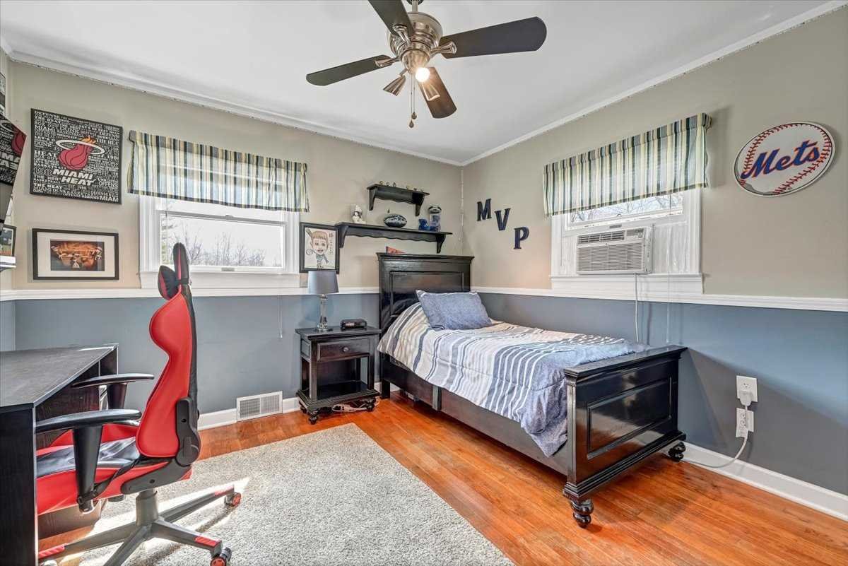 6 Broadview Road Poughkeepsie, NY 12603 - Photo 25 of 35 a bedroom with a bed and a chandelier