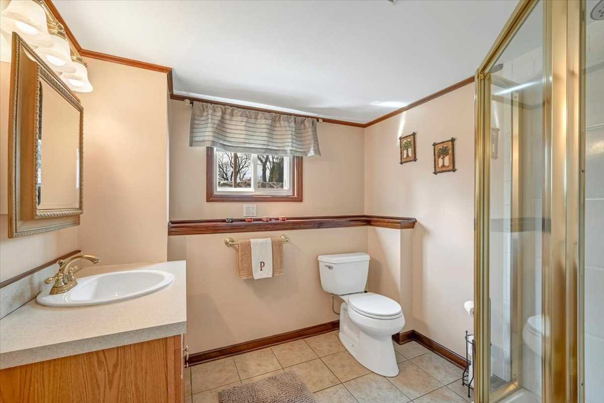 6 Broadview Road Poughkeepsie, NY 12603 - Photo 28 of 35 a bathroom with a granite countertop toilet a sink and a mirror