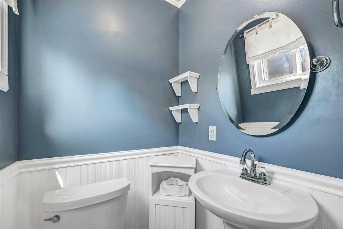 6 Broadview Road Poughkeepsie, NY 12603 - Photo 30 of 35 a bathroom with a toilet a sink and mirror