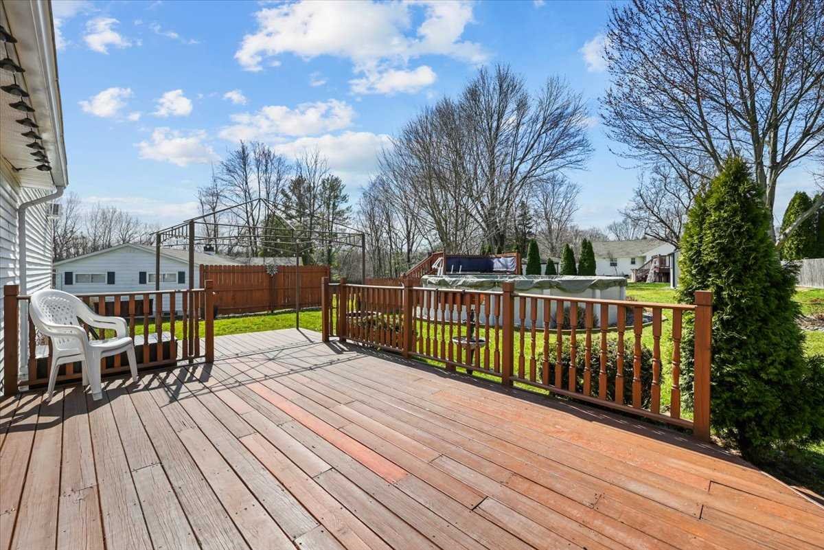 6 Broadview Road Poughkeepsie, NY 12603 - Photo 31 of 35 a view of a roof deck with table and chairs a barbeque with wooden floor and fence