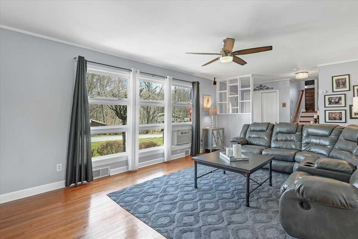 6 Broadview Road Poughkeepsie, NY 12603 - Photo 8 of 35 a living room with furniture and a floor to ceiling window