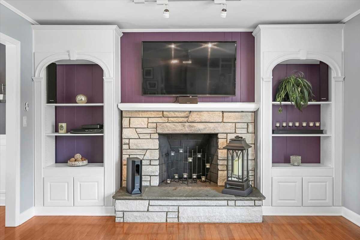 6 Broadview Road Poughkeepsie, NY 12603 - Photo 10 of 35 a living room with a fireplace and a flat screen tv