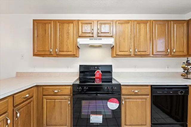 a kitchen with a stove and a microwave