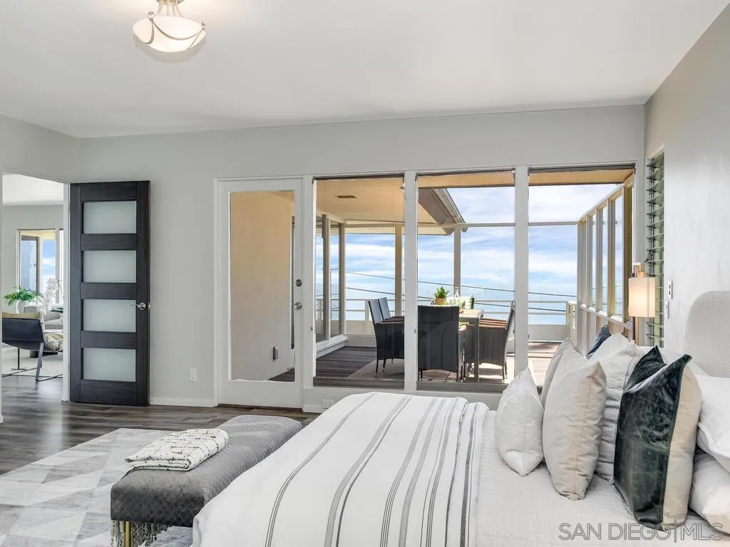 1010 La Jolla Rancho Road La Jolla, CA 92037 - Photo 18 of 35 a bedroom with furniture and a large window
