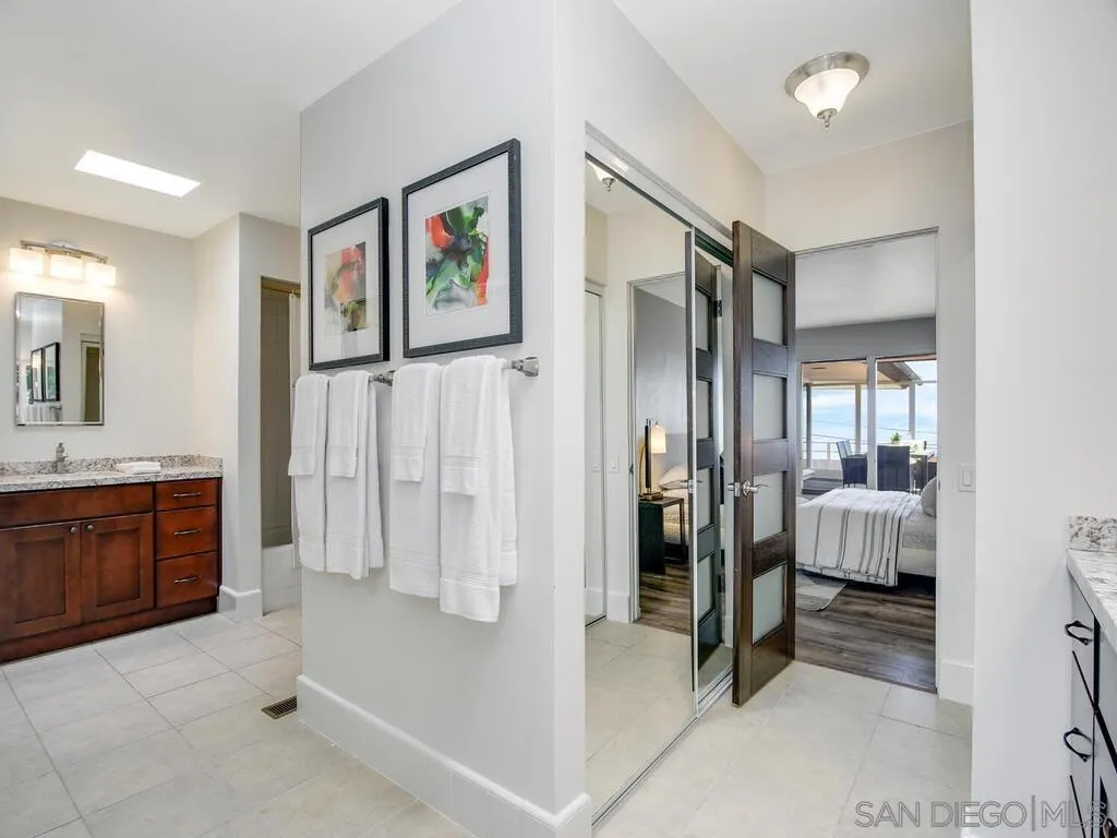 1010 La Jolla Rancho Road La Jolla, CA 92037 - Photo 20 of 35 a spacious bathroom with a tub shower and window