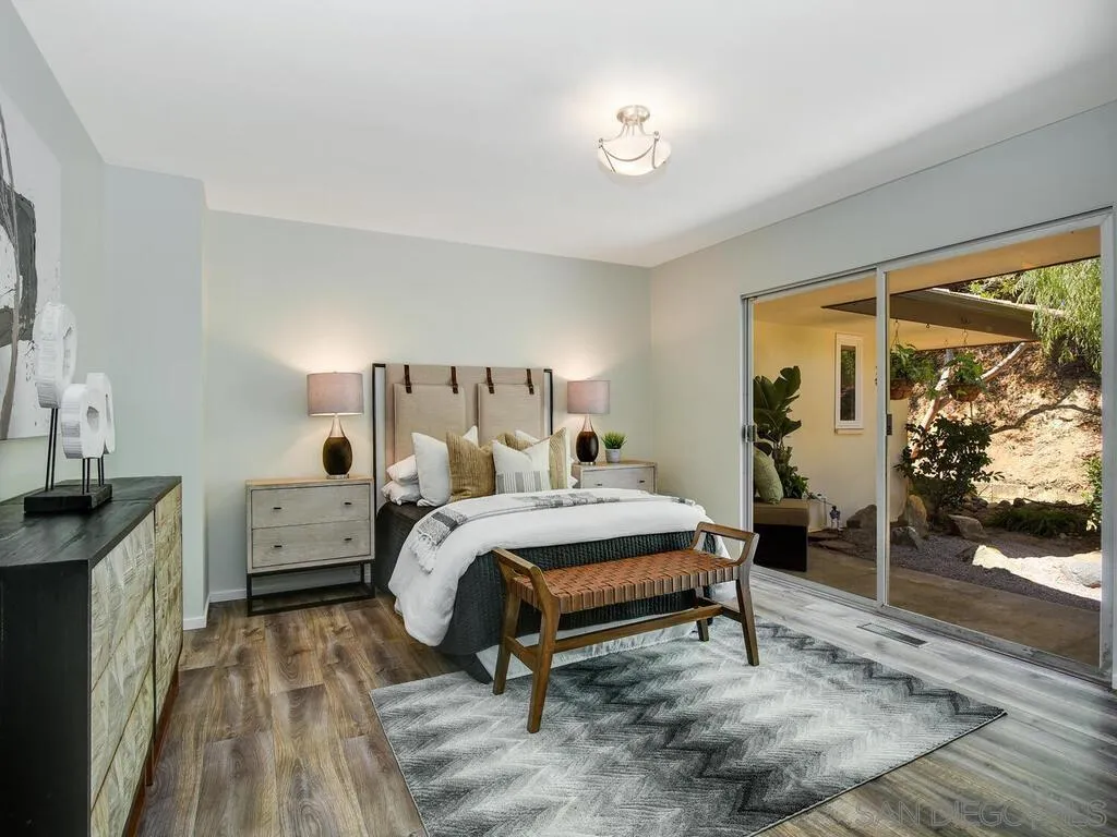1010 La Jolla Rancho Road La Jolla, CA 92037 - Photo 23 of 35 a bed room with a bed and a window