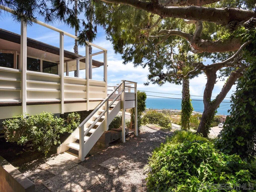 1010 La Jolla Rancho Road La Jolla, CA 92037 - Photo 25 of 35 a view of a house with a yard