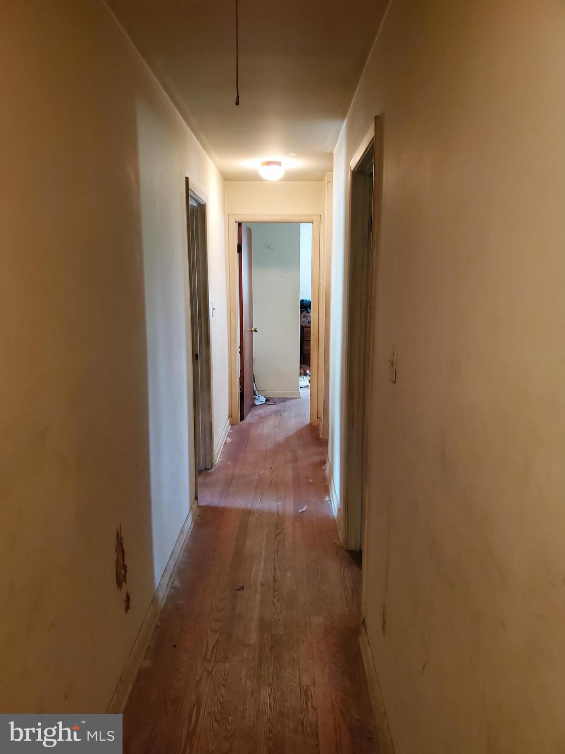 927 Old Annapolis Neck Road Annapolis, MD 21403 - Photo 8 of 9 a view of a hallway with wooden floor