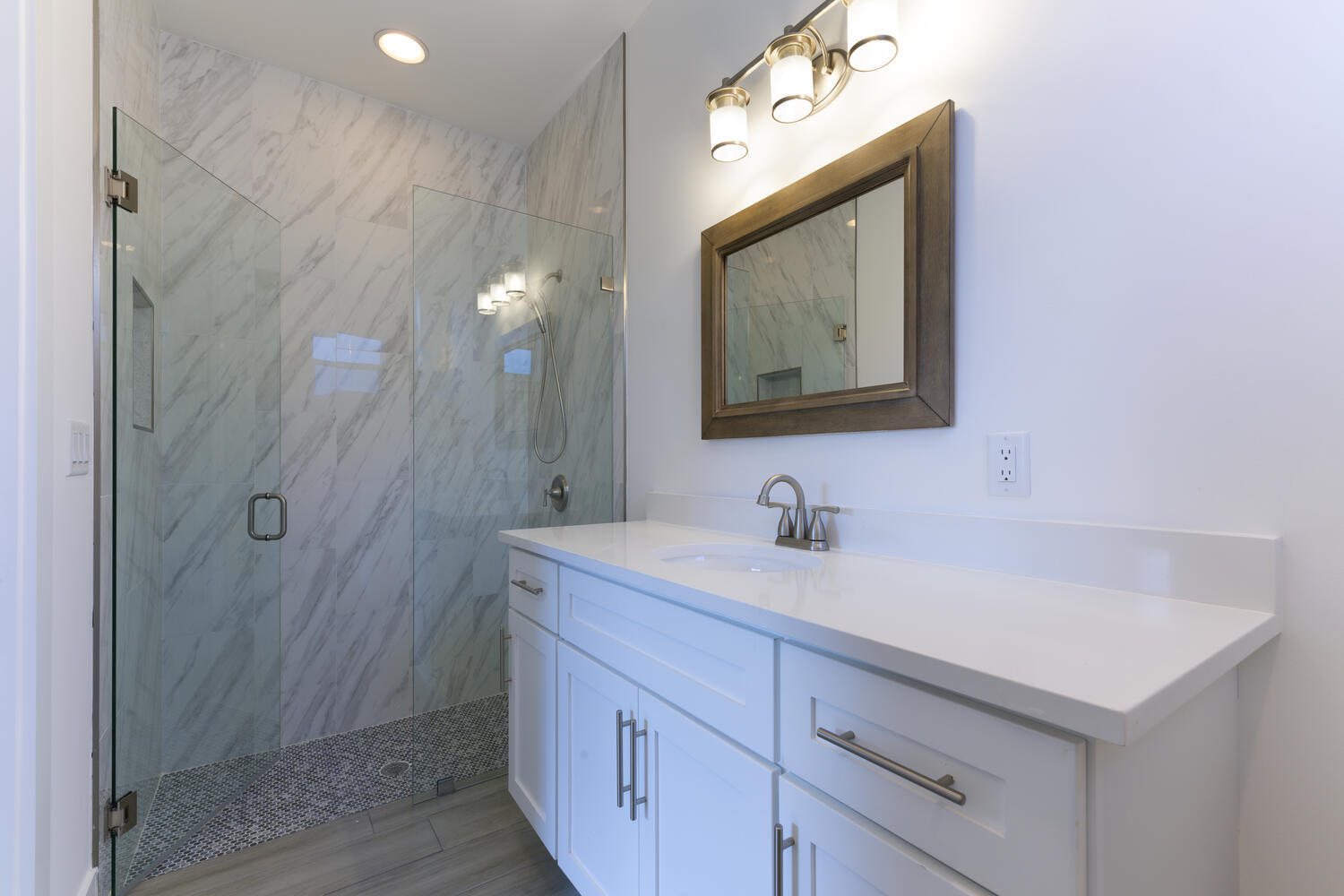 18050 Limestone Creek Road Jupiter, FL 33458 - Photo 12 of 26 a bathroom with a sink vanity and mirror