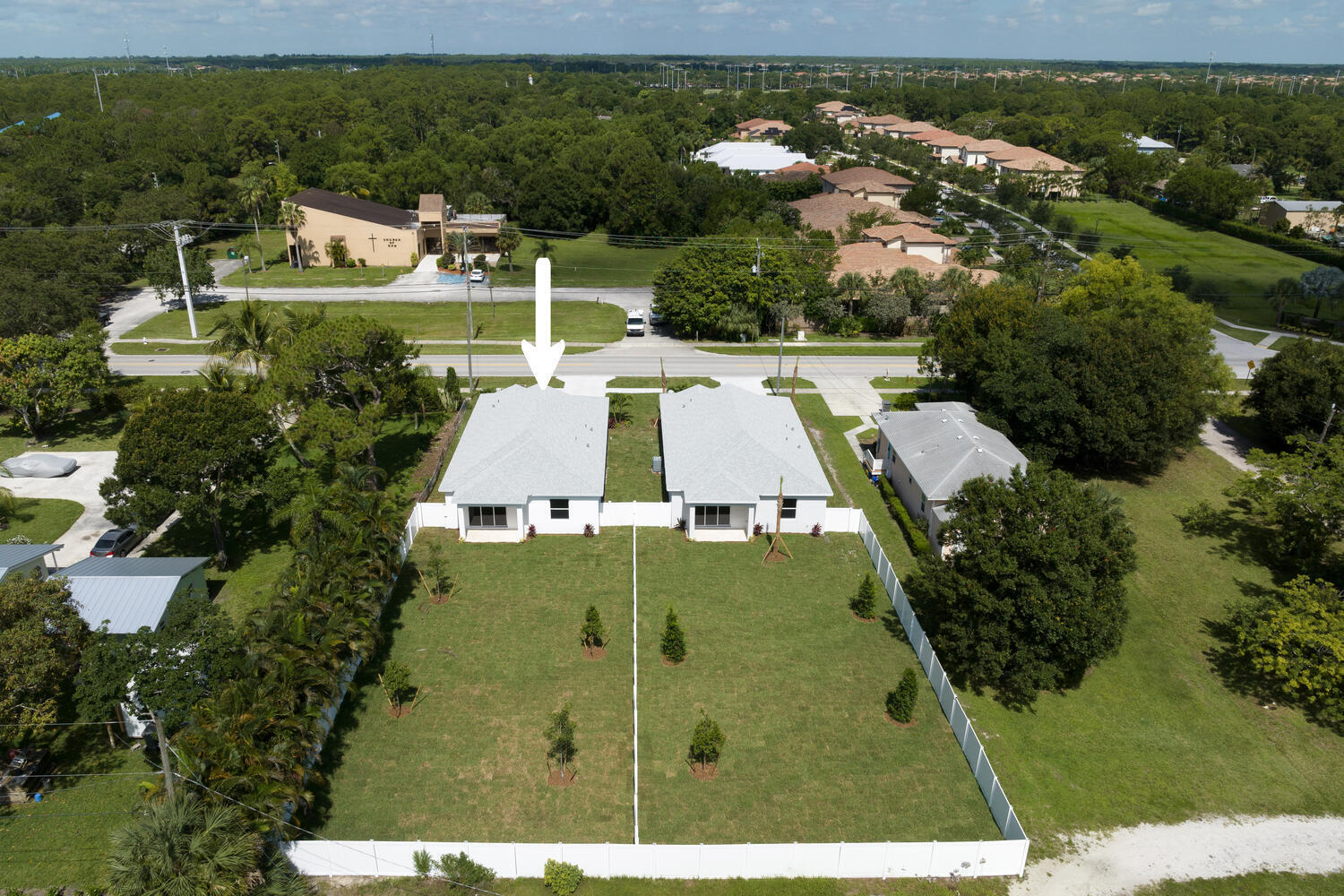 18050 Limestone Creek Road Jupiter, FL 33458 - Photo 3 of 26 an aerial view of a house with a yard basket ball court and outdoor seating