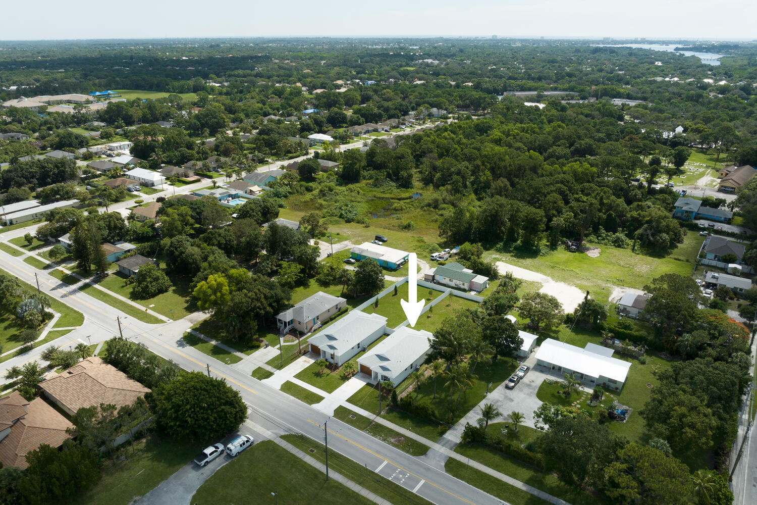 18050 Limestone Creek Road Jupiter, FL 33458 - Photo 4 of 26 an aerial view of residential houses with outdoor space