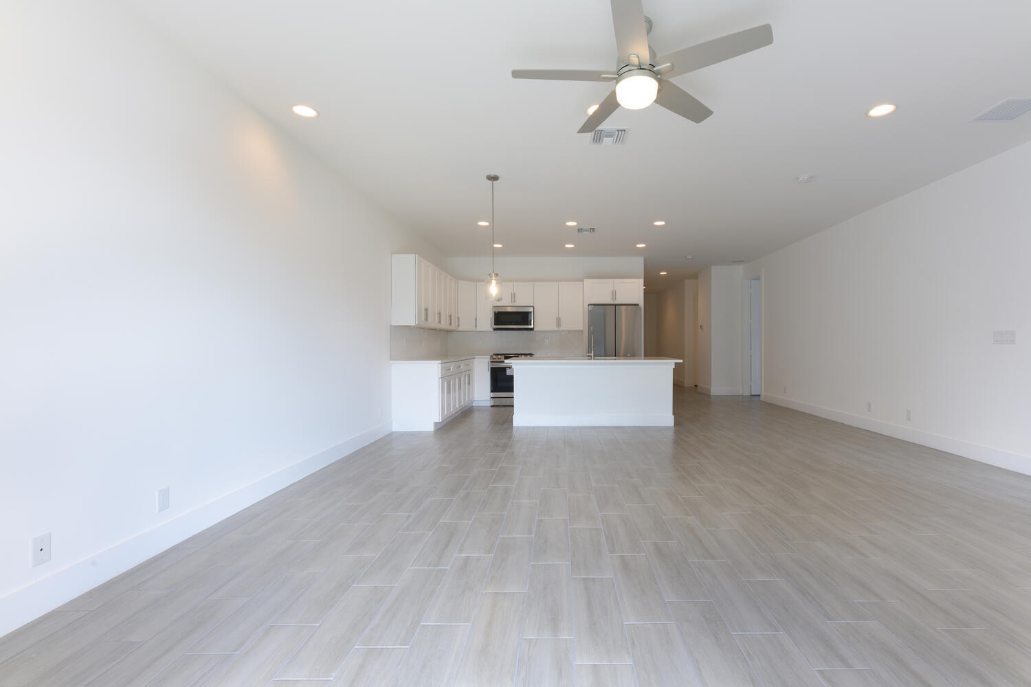 18050 Limestone Creek Road Jupiter, FL 33458 - Photo 8 of 26 a view of a kitchen with a sink and a refrigerator