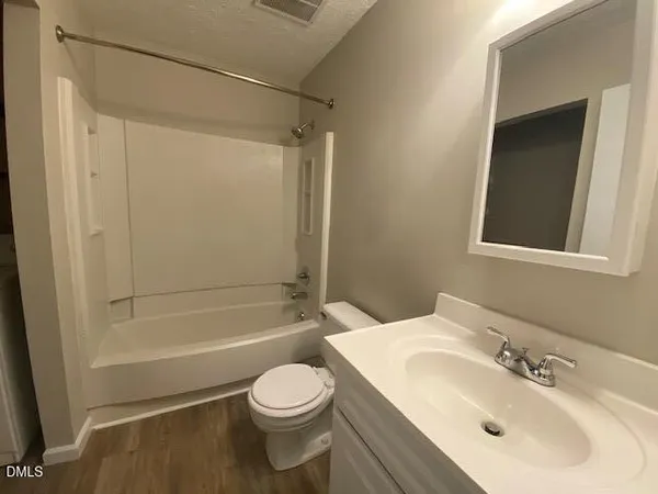 a bathroom with a toilet a sink and a bathtub