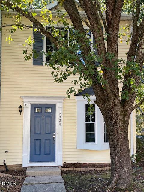 8129 McGuire Drive Raleigh, NC 27616 - Photo 2 of 14 a front view of a house with a tree