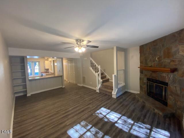 8129 McGuire Drive Raleigh, NC 27616 - Photo 4 of 14 a living room with wooden floor and a fireplace
