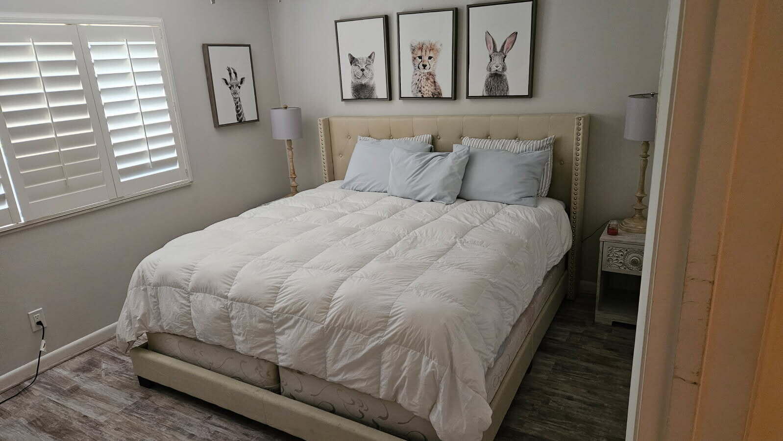 500 Ocean Trail Way, Unit 307 Jupiter, FL 33477 - Photo 8 of 18 a bed sitting in a bedroom next to a window