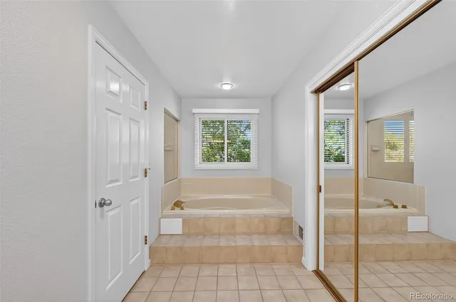 a view of an entryway with wooden floor and a livingroom