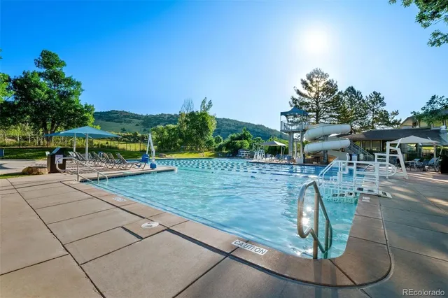 a view of a swimming pool with a patio