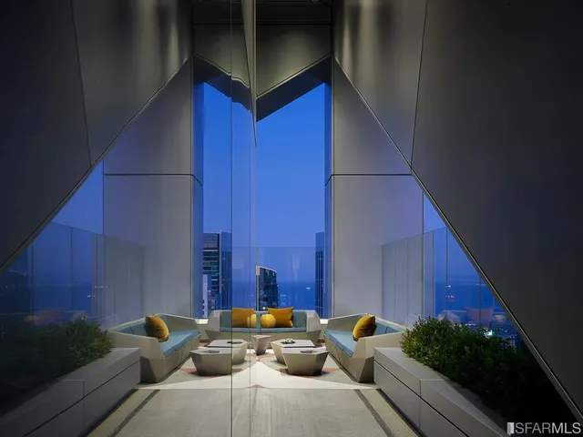 a couple of cars parked in front of a building