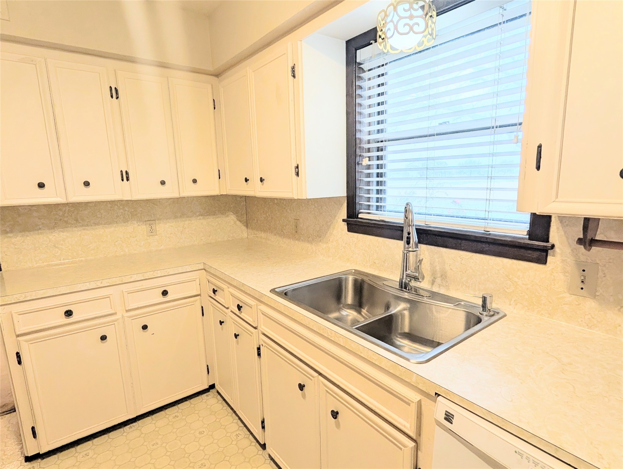 4779 Mixville Road Sealy, TX 77474 - Photo 15 of 47 a kitchen with granite countertop white cabinets and sink