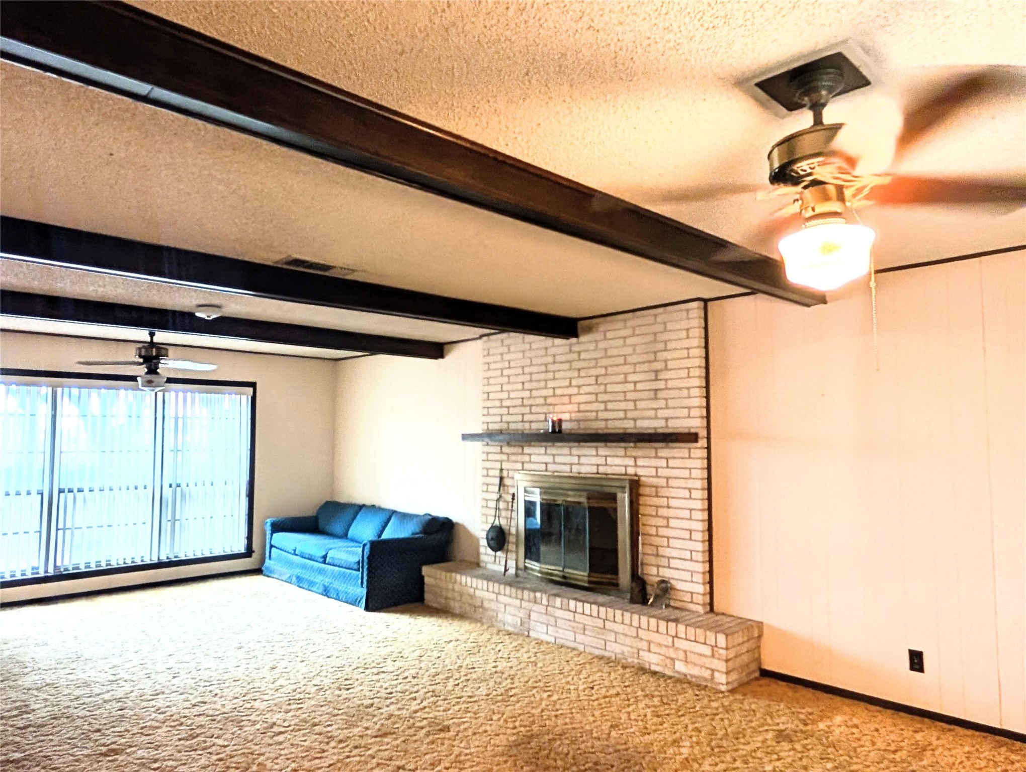 4779 Mixville Road Sealy, TX 77474 - Photo 3 of 37 a view of a livingroom with a fireplace and cabinet