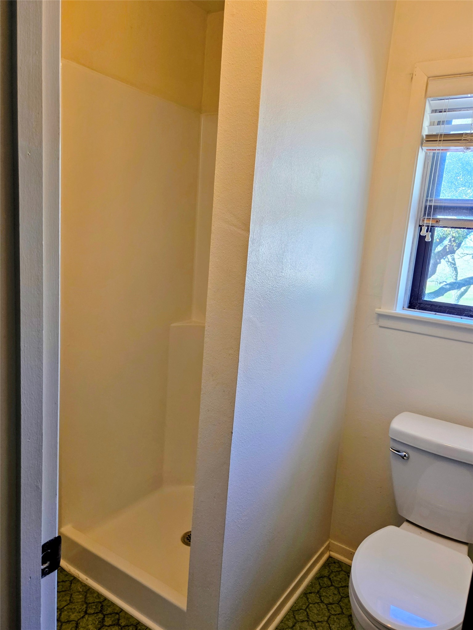 4779 Mixville Road Sealy, TX 77474 - Photo 45 of 47 a white toilet sitting next to a shower