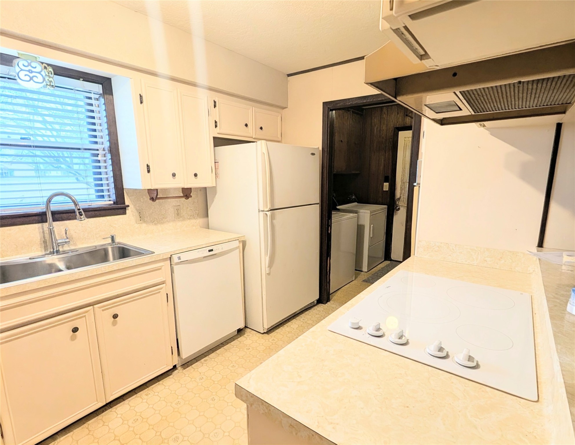 4779 Mixville Road Sealy, TX 77474 - Photo 9 of 37 a kitchen with stainless steel appliances a refrigerator and a sink