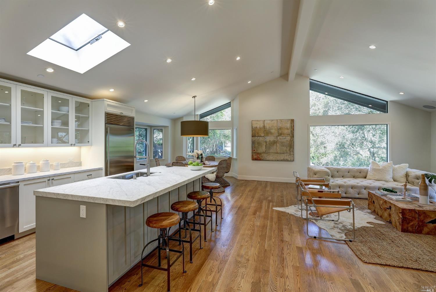 99 Rancheria Road Kentfield, CA 94904 - Photo 1 of 1 a living room with stainless steel appliances kitchen island granite countertop furniture and a large window