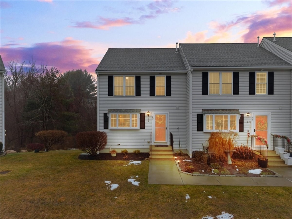 2697 Cranberry Highway, Unit 28 Wareham, MA 02571 - Photo 2 of 37 a front view of a house with a yard