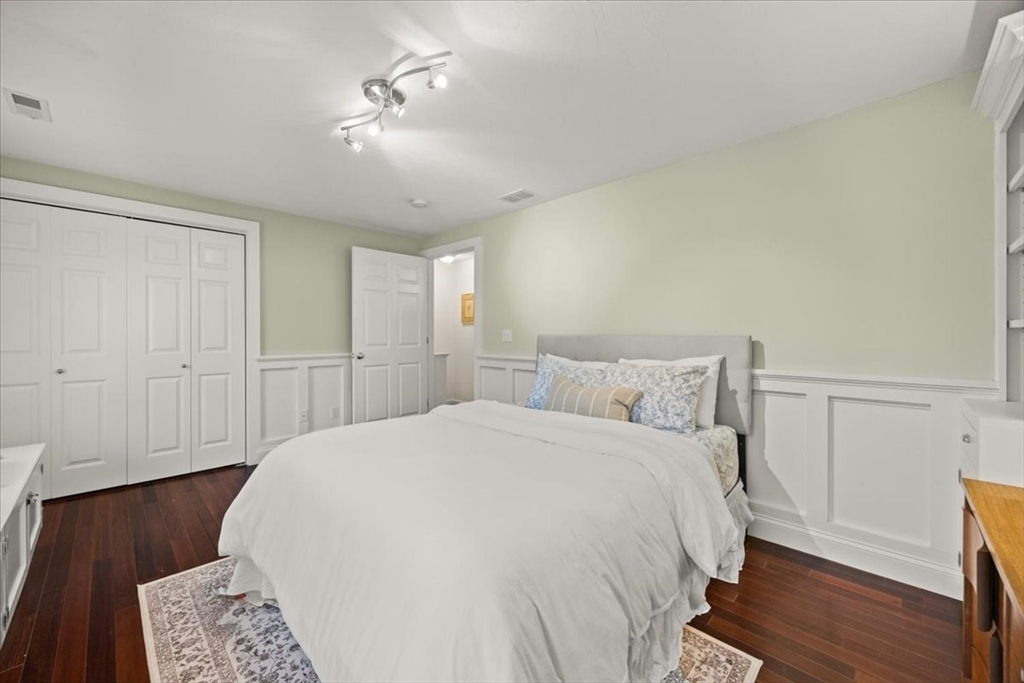 2697 Cranberry Highway, Unit 28 Wareham, MA 02571 - Photo 22 of 37 a spacious bedroom with a bed and a table
