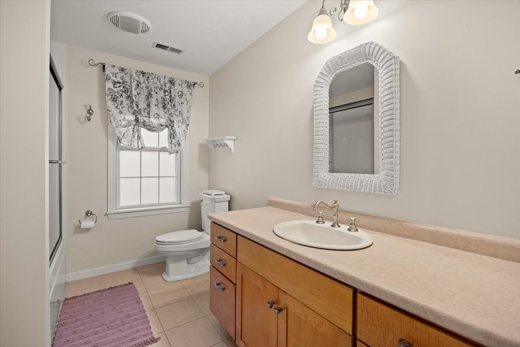 2697 Cranberry Highway, Unit 28 Wareham, MA 02571 - Photo 23 of 37 a bathroom with a sink a toilet and shower