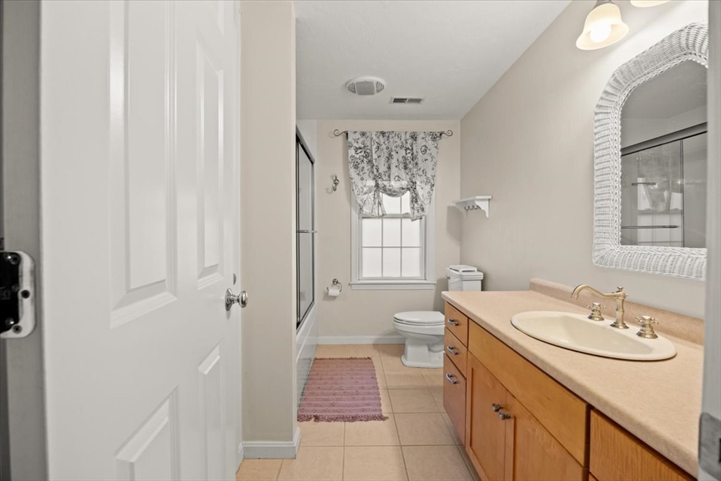 2697 Cranberry Highway, Unit 28 Wareham, MA 02571 - Photo 24 of 37 a bathroom with a sink a toilet and a mirror
