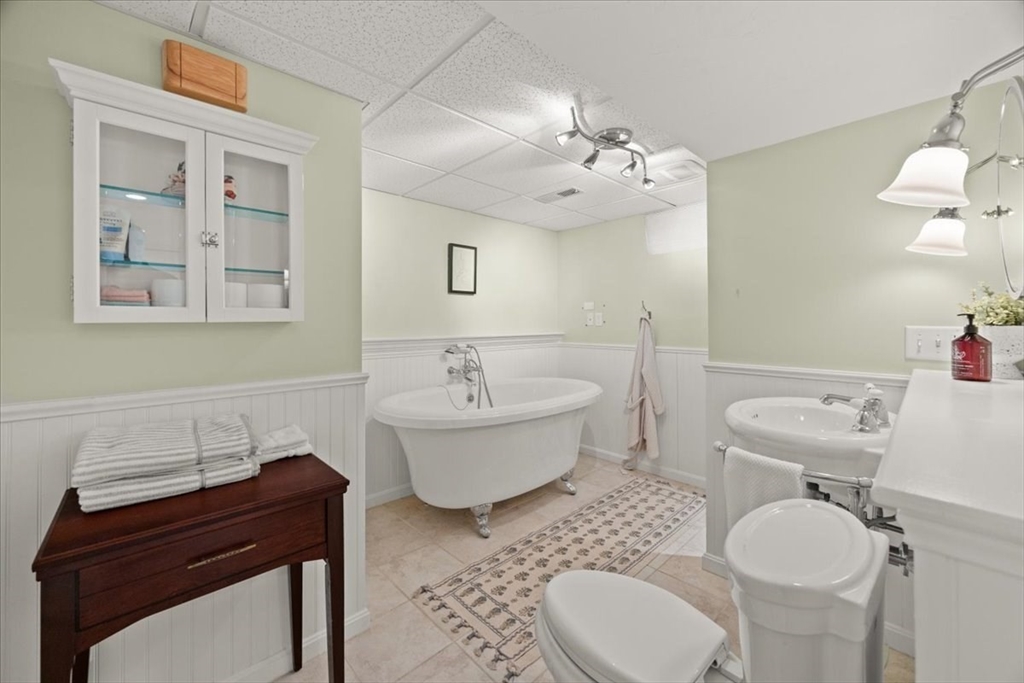 2697 Cranberry Highway, Unit 28 Wareham, MA 02571 - Photo 27 of 37 a spacious bathroom with a toilet a sink and bathtub