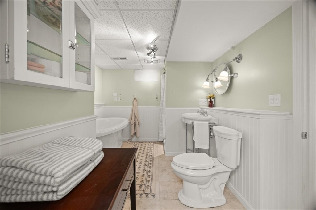 2697 Cranberry Highway, Unit 28 Wareham, MA 02571 - Photo 28 of 37 a bathroom with a sink a toilet and a mirror