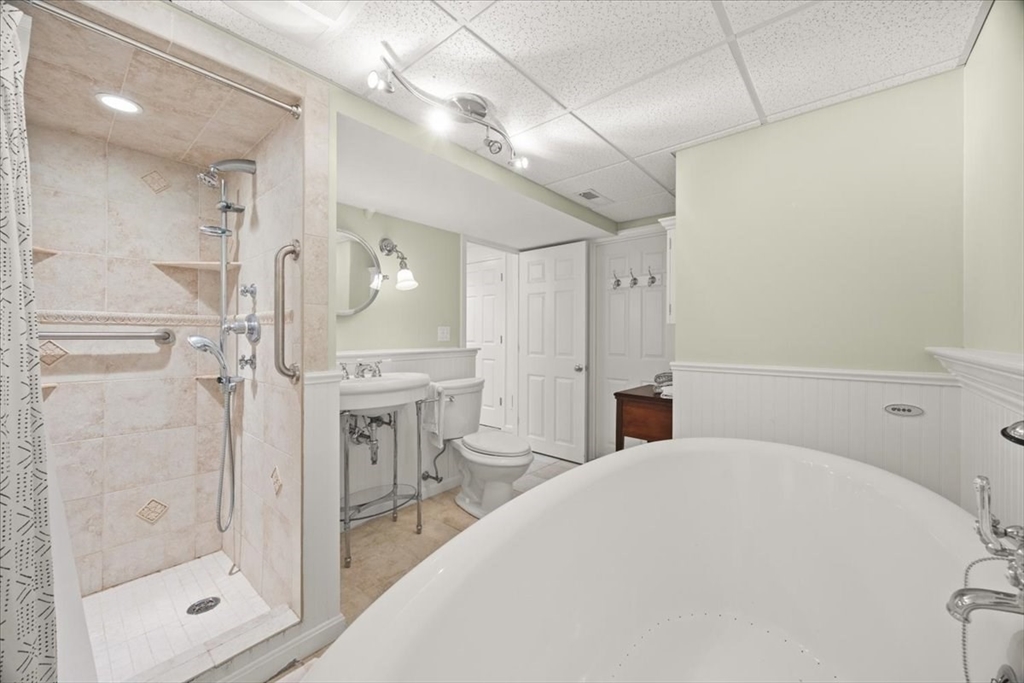 2697 Cranberry Highway, Unit 28 Wareham, MA 02571 - Photo 29 of 37 a spacious bathroom with a bathtub and a shower