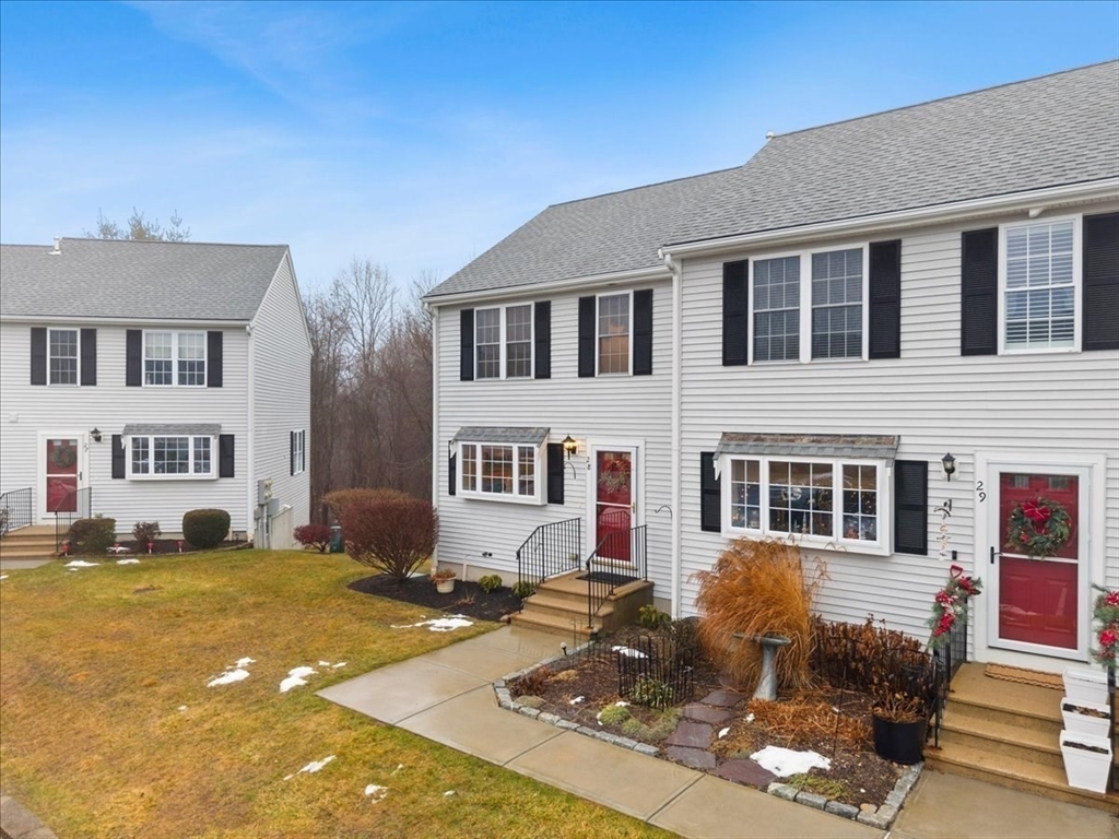 2697 Cranberry Highway, Unit 28 Wareham, MA 02571 - Photo 4 of 37 a front view of a house with a yard