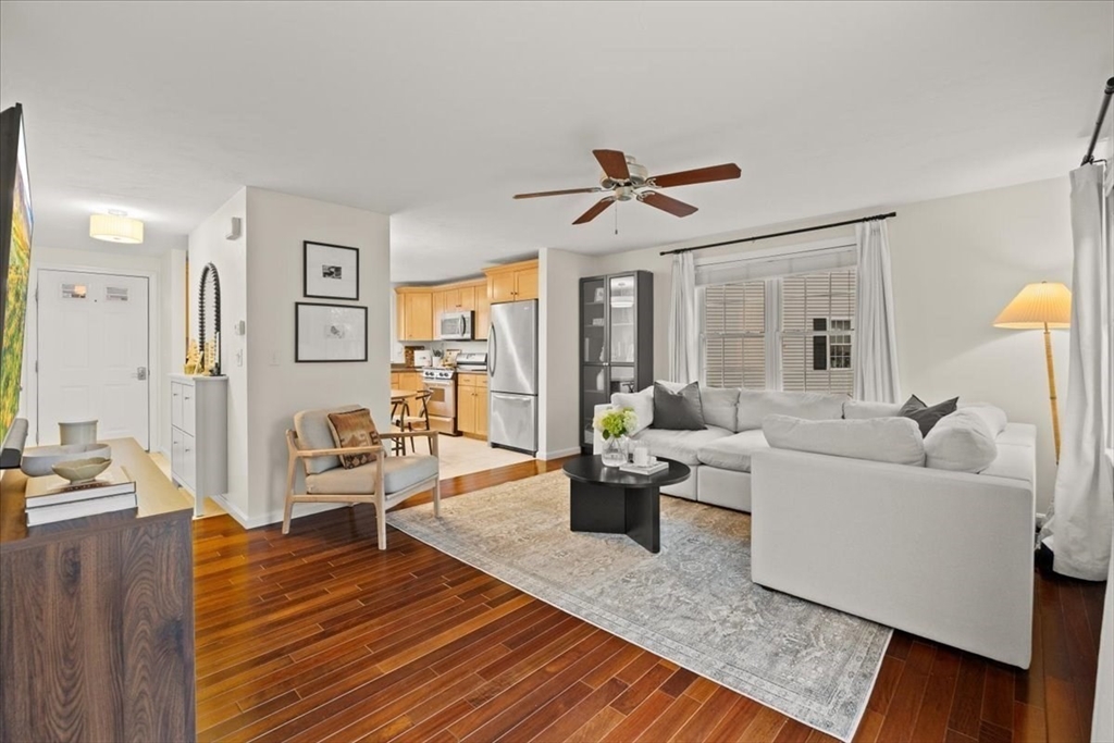 2697 Cranberry Highway, Unit 28 Wareham, MA 02571 - Photo 6 of 37 a living room with furniture and a wooden floor