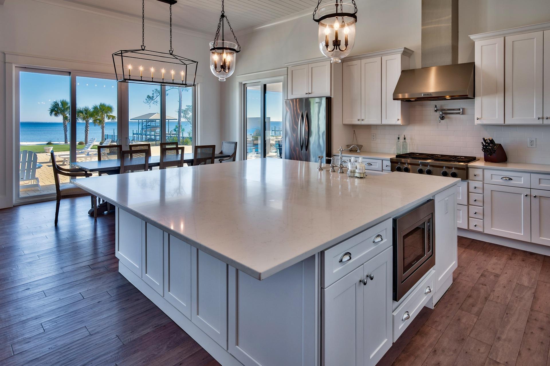 1591 Driftwood Point Road Santa Rosa Beach, FL 32459 - Photo 11 of 50 a large kitchen with stainless steel appliances granite countertop a stove and a wooden floors