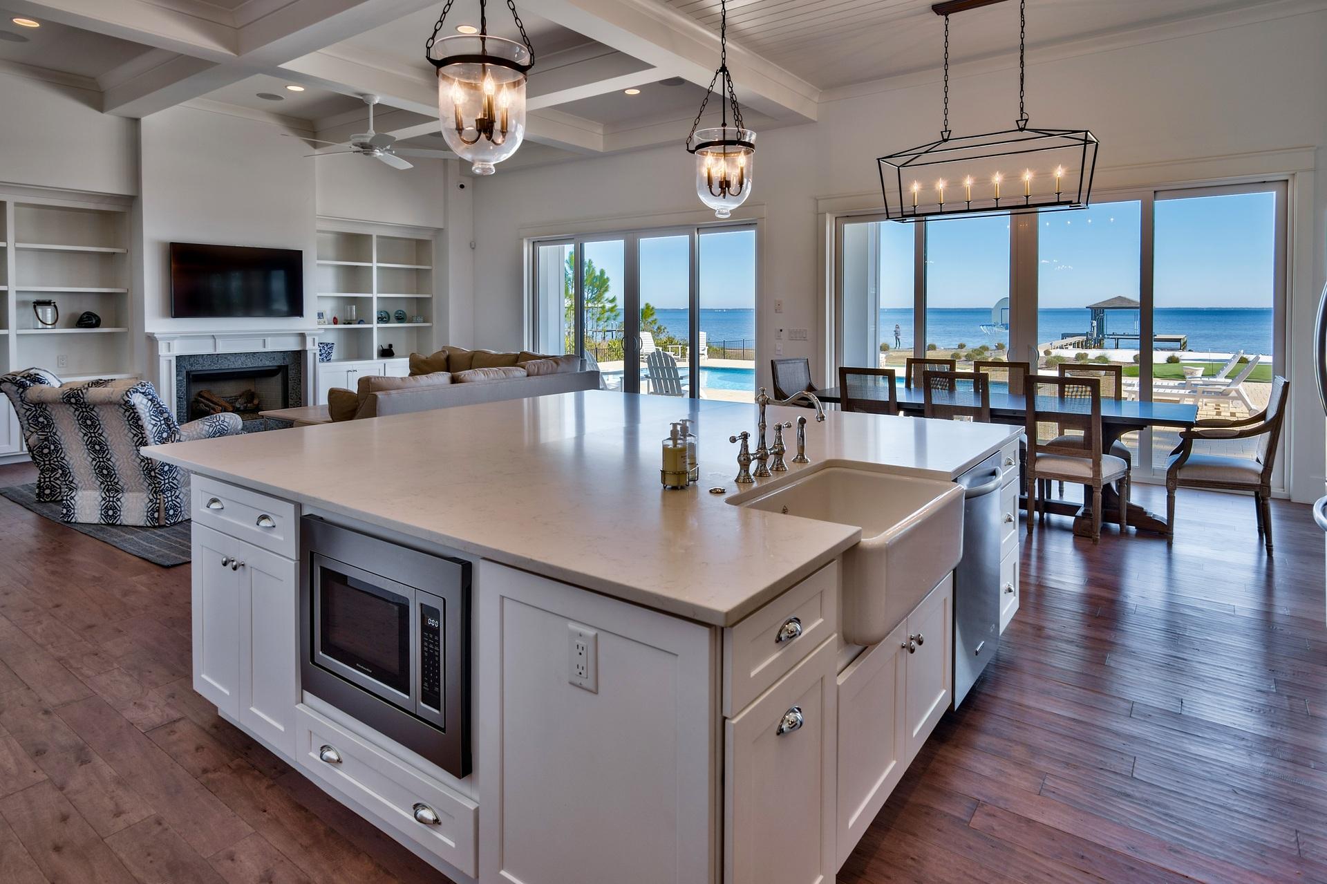 1591 Driftwood Point Road Santa Rosa Beach, FL 32459 - Photo 12 of 50 a kitchen with stainless steel appliances granite countertop a stove and a wooden floors