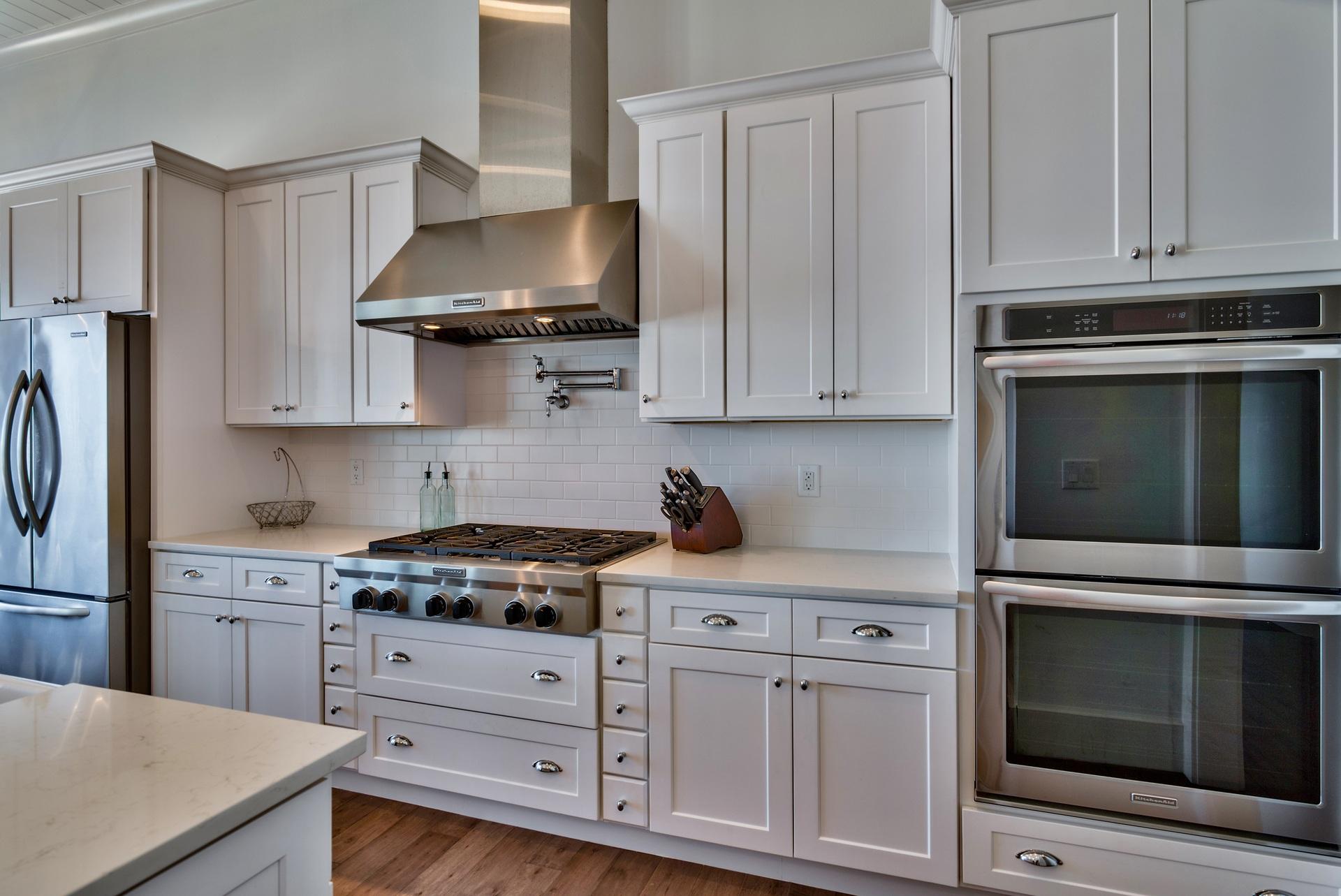 1591 Driftwood Point Road Santa Rosa Beach, FL 32459 - Photo 13 of 50 a kitchen with stainless steel appliances granite countertop a stove and a microwave with cabinets