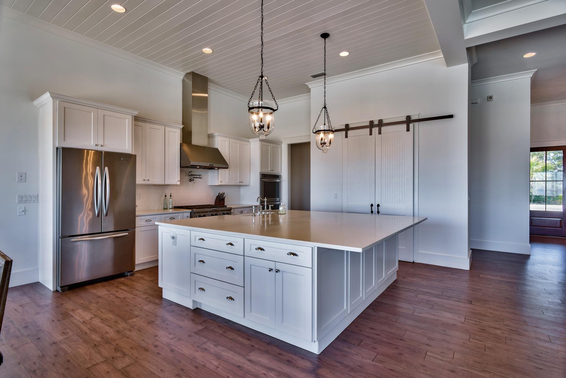 1591 Driftwood Point Road Santa Rosa Beach, FL 32459 - Photo 14 of 50 a kitchen with kitchen island a counter top stainless steel appliances and wooden floor