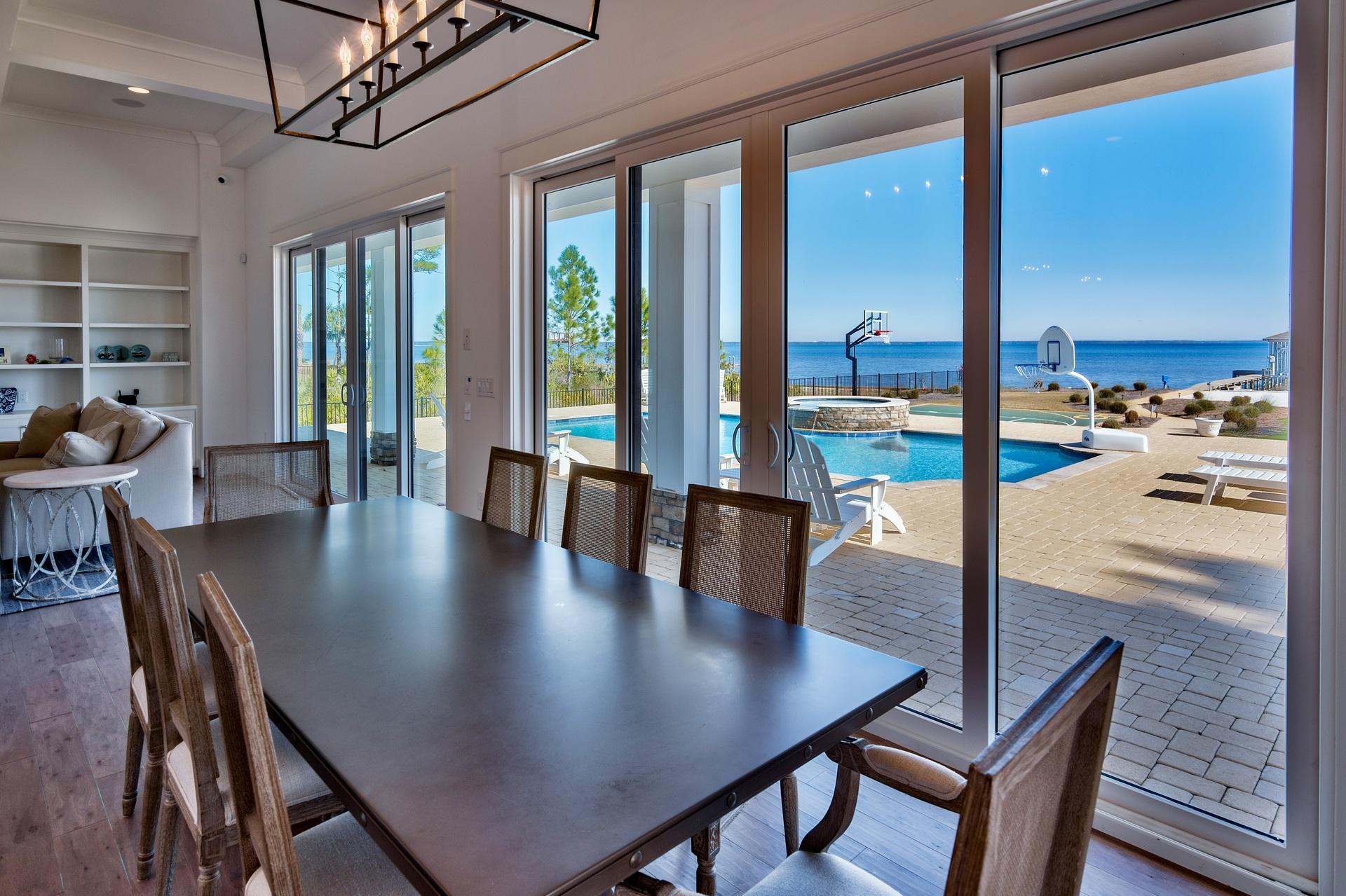 1591 Driftwood Point Road Santa Rosa Beach, FL 32459 - Photo 15 of 50 a view of a dining room with furniture and window