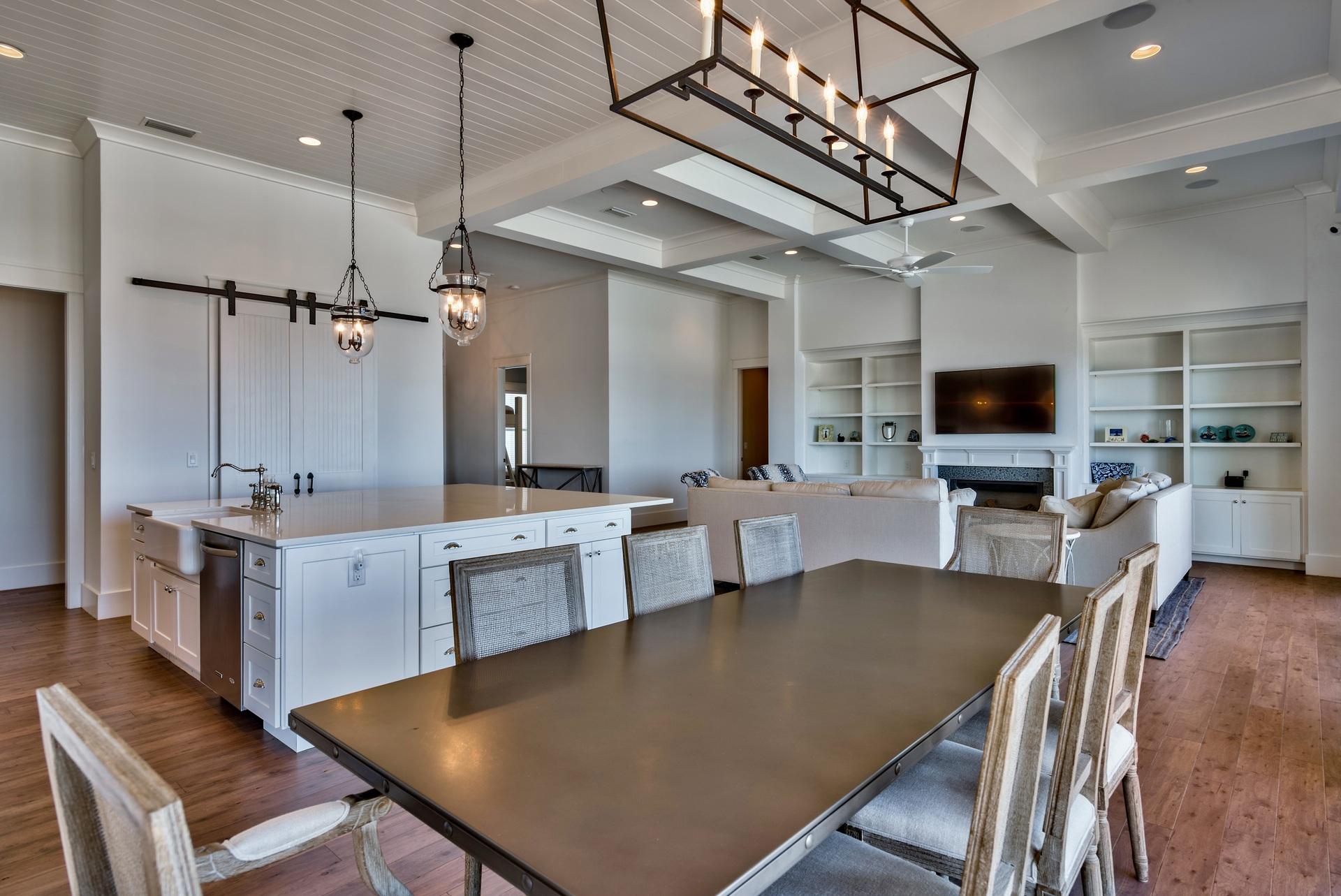 1591 Driftwood Point Road Santa Rosa Beach, FL 32459 - Photo 16 of 50 a large kitchen with a table chairs wooden floor and a view of kitchen