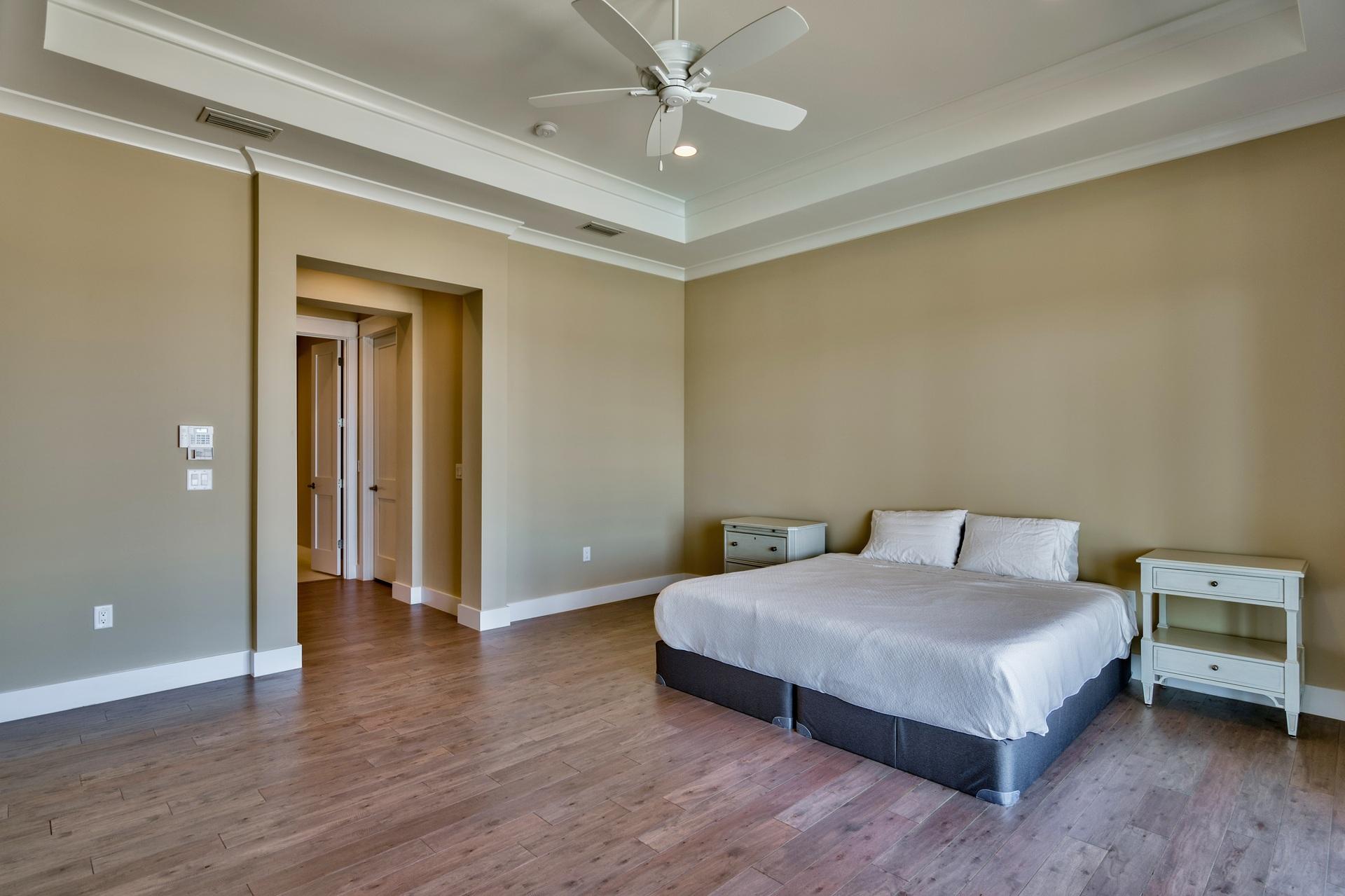 1591 Driftwood Point Road Santa Rosa Beach, FL 32459 - Photo 22 of 50 a bedroom with a bed and a chandelier