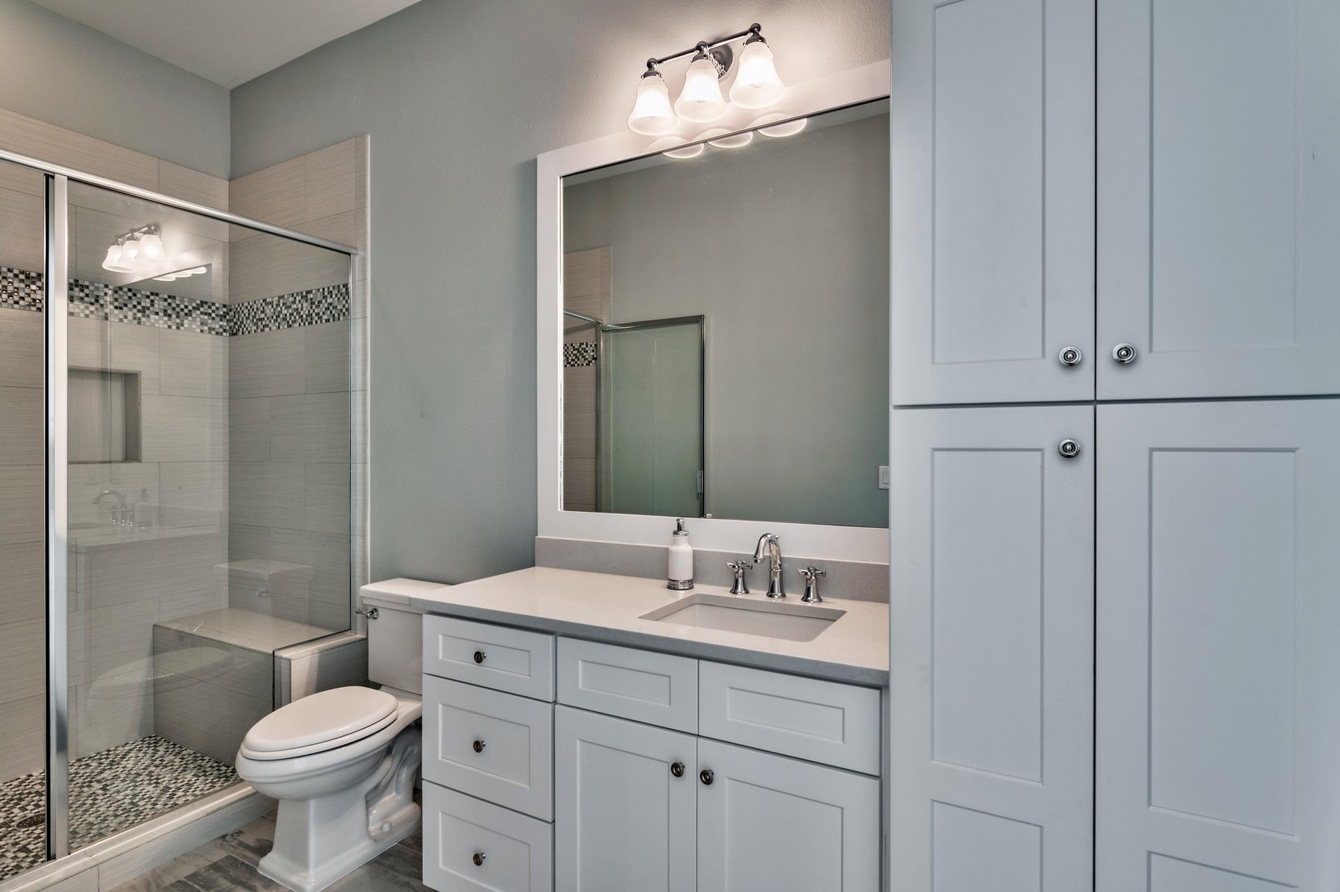 1591 Driftwood Point Road Santa Rosa Beach, FL 32459 - Photo 27 of 50 a bathroom with a toilet sink and mirror