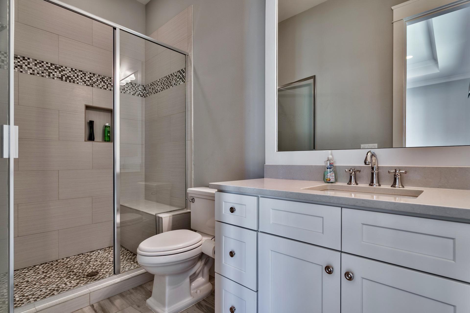 1591 Driftwood Point Road Santa Rosa Beach, FL 32459 - Photo 30 of 50 a bathroom with a toilet sink vanity and shower