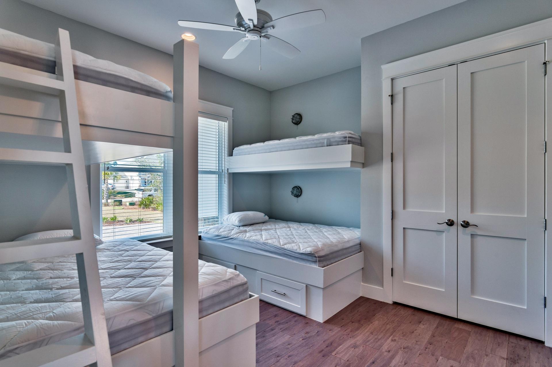 1591 Driftwood Point Road Santa Rosa Beach, FL 32459 - Photo 31 of 50 a spacious bedroom with a bed and a chandelier