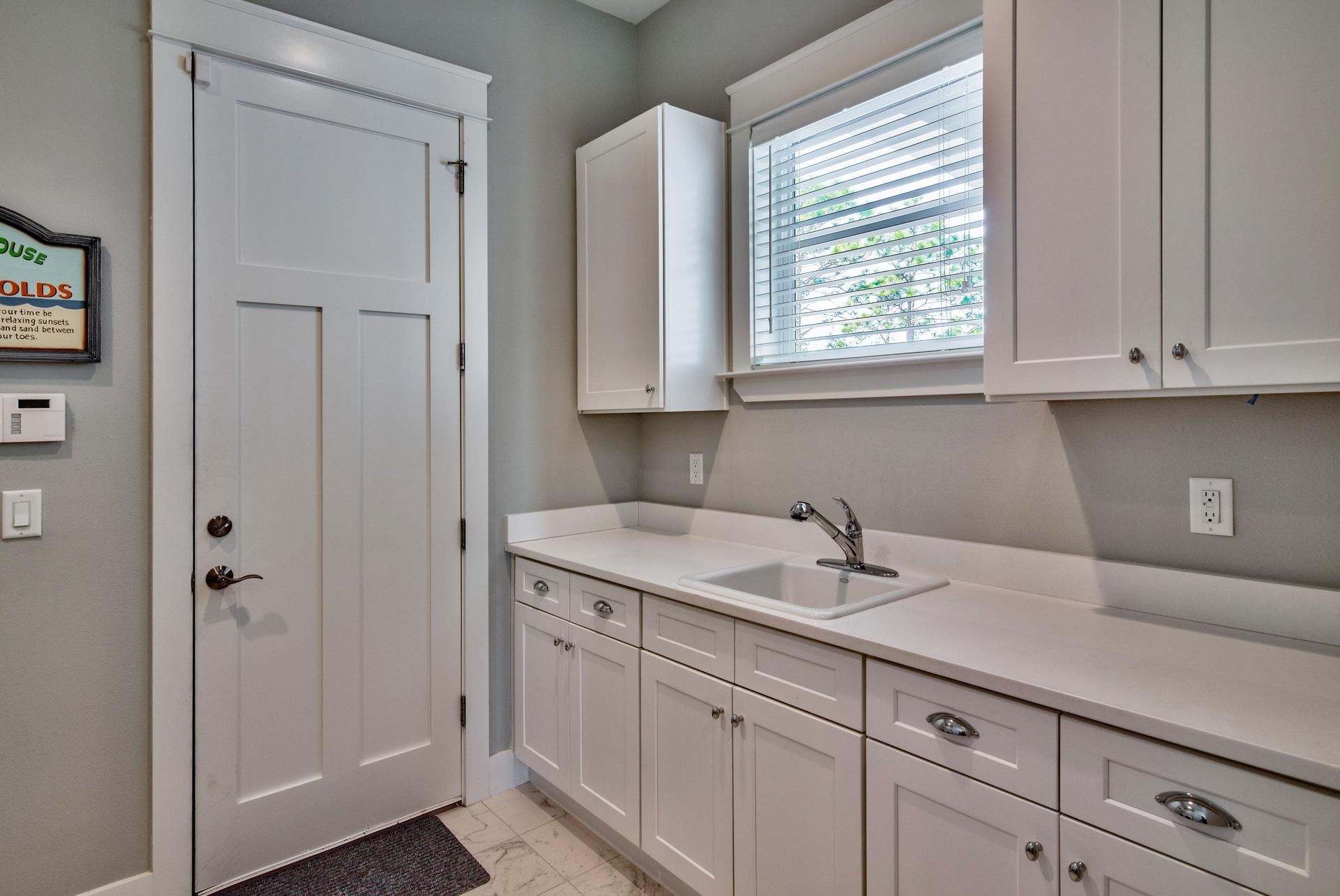 1591 Driftwood Point Road Santa Rosa Beach, FL 32459 - Photo 34 of 50 a kitchen with a sink cabinets and window